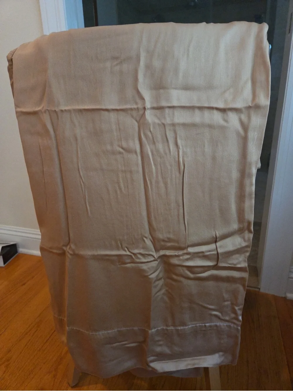 Three brown cotton king sized pillow cases
